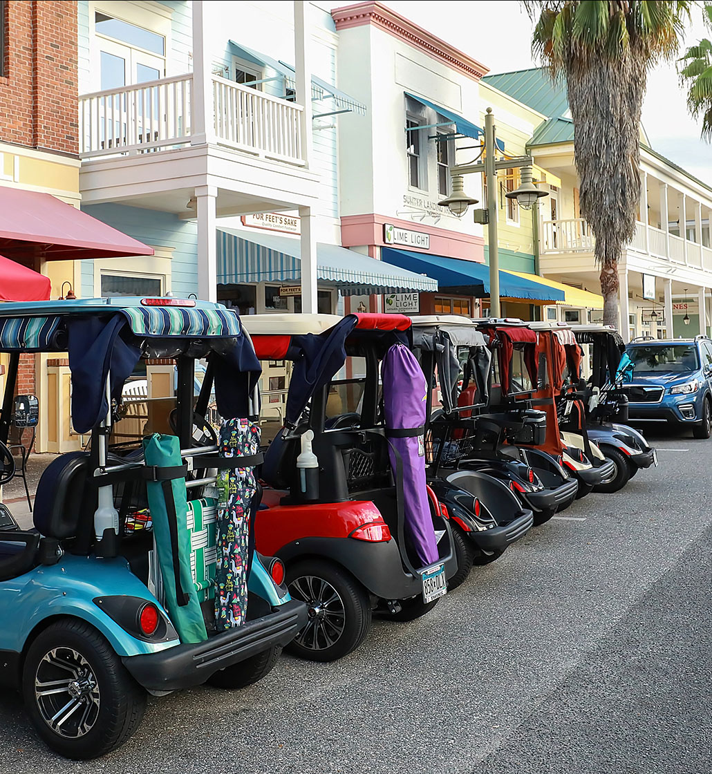 Golf carts parked along a street in The Villages