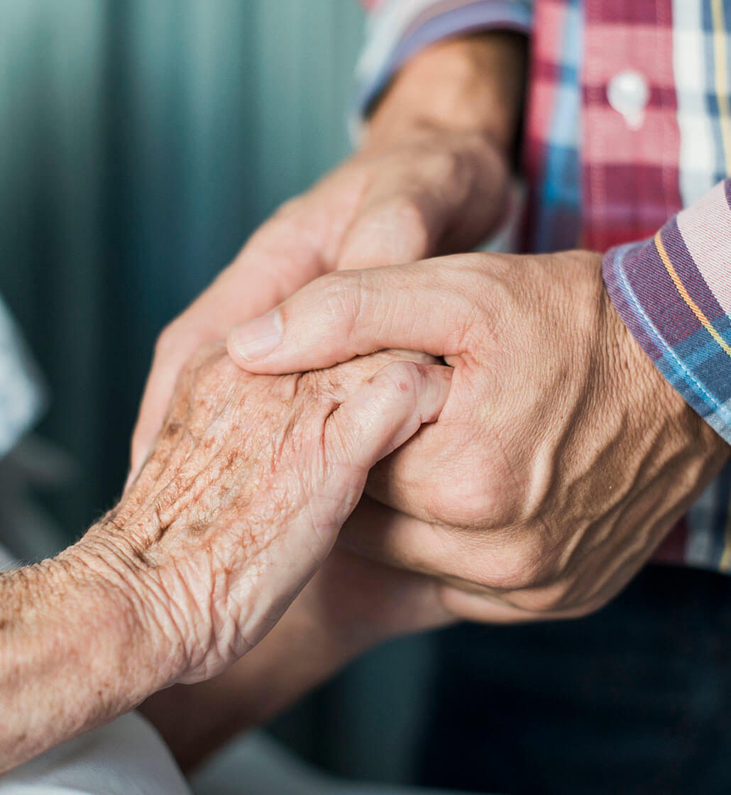 A close-up of hands being held.